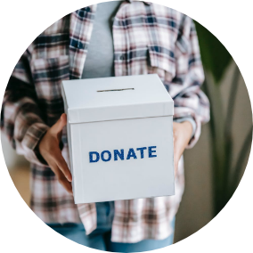 Someone holds a box labeled donate